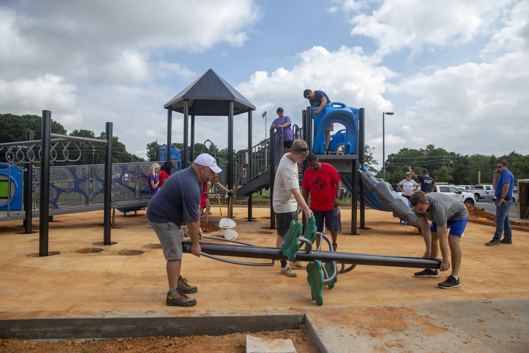 Volunteers assemble playground